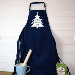 a personalised Christmas apron hanging in a kitchen