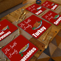 personalised Christmas placemats on a wooden table