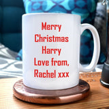 An image showing the reverse of the mug with a message printed on it in red text. The message reads "merry Christmas Harry love from Rachel xxx"