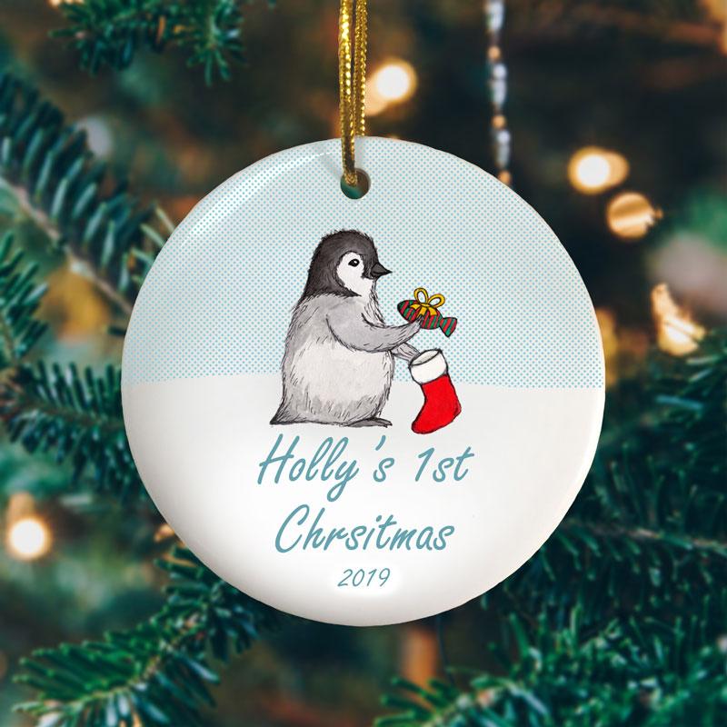 A penguins first Christmas personalised circle bauble