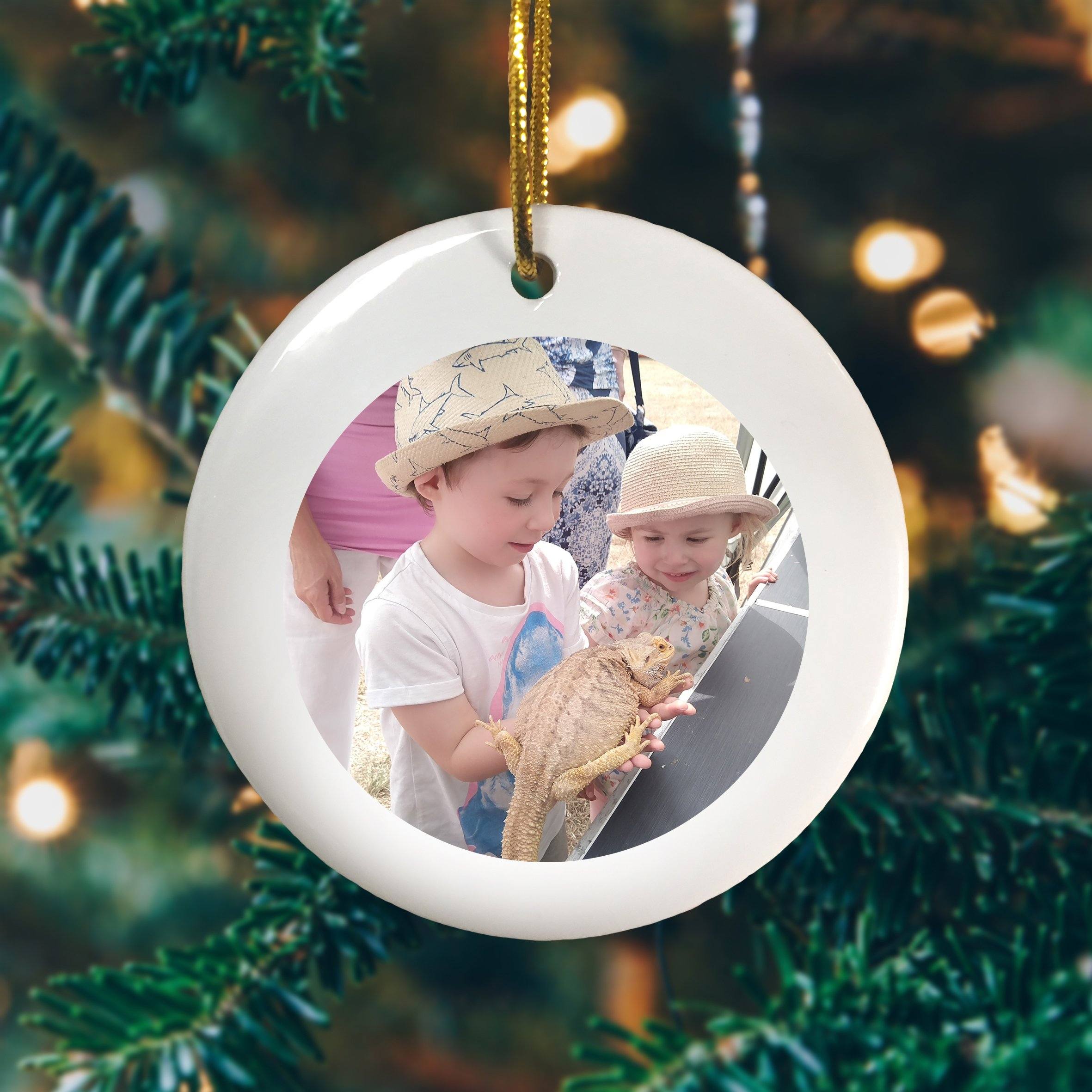 A personalised ceramic decoration with a photo of 2 children printed onto it