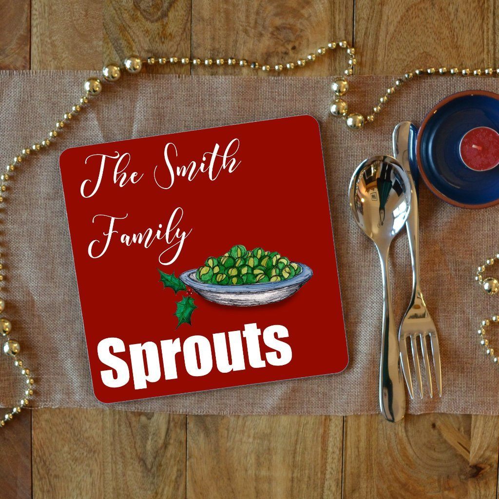 a personalised sprouts Christmas placemat with white text which says "the Smith family sprouts" on a red background