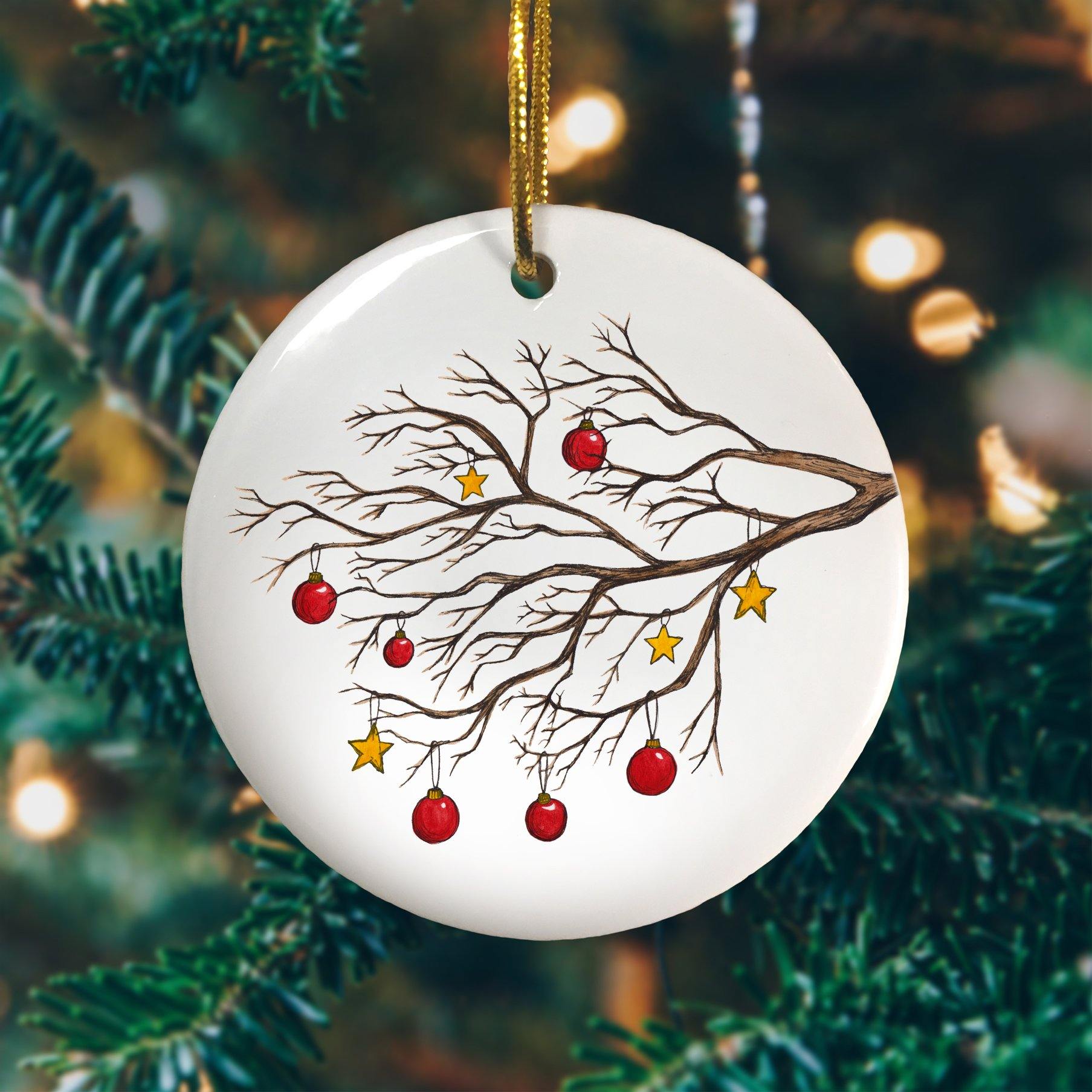 A personalised Christmas tree circle decoration with an illustration of a winter tree printed on it