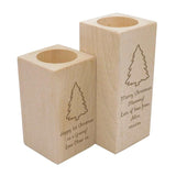 A small and large personalised wooden candle holders with engraved messages.