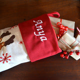 a close up of the embroidered name on a personalised Christmas stocking