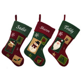 3 personalised vintage style Christmas stockings, the stockings feature a deep red and green patchwork design and either a Father Christmas a snowman or a reindeer. Each stocking is embroidered with a name on the top. 