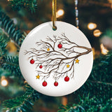 A personalised Christmas tree circle decoration with an illustration of a winter tree printed on it 